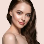 Beautiful hair skin woman beauty female portrait natural make up long hair. Color background yellow